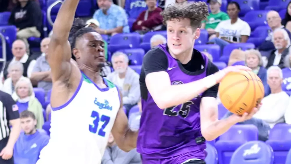 UCA Bears forward Elias Cato looks to make a pass against Florida Gulf Coast