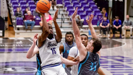 UCA Bears forward Michael Evbagharu puts up a shot inside against North Florida