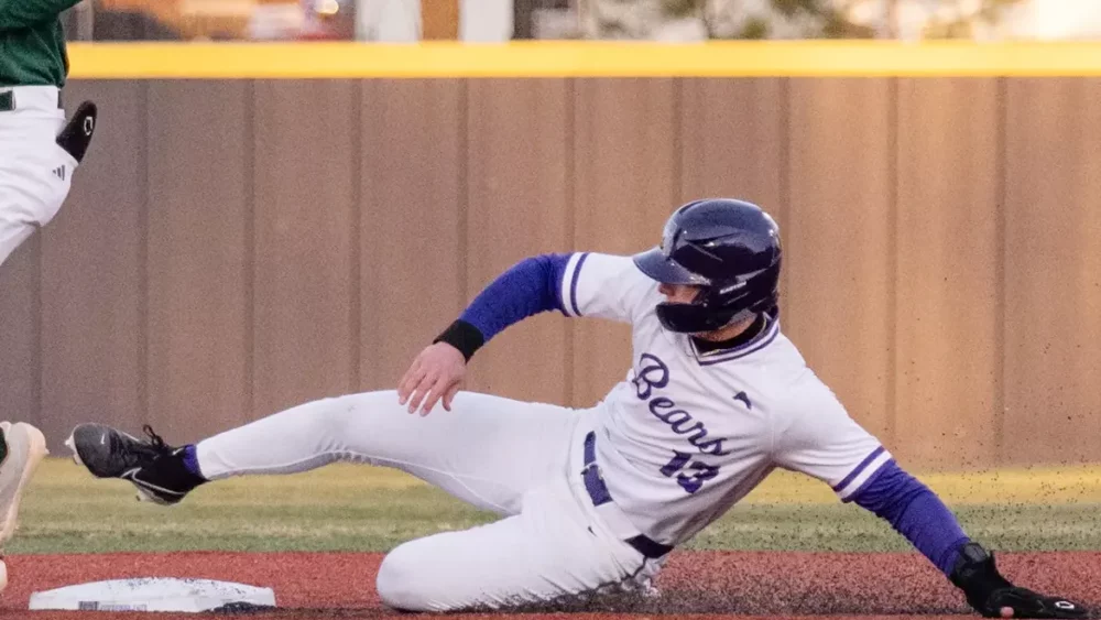 UCA Bears Sam Reynolds slides into second base against Eastern Michigan