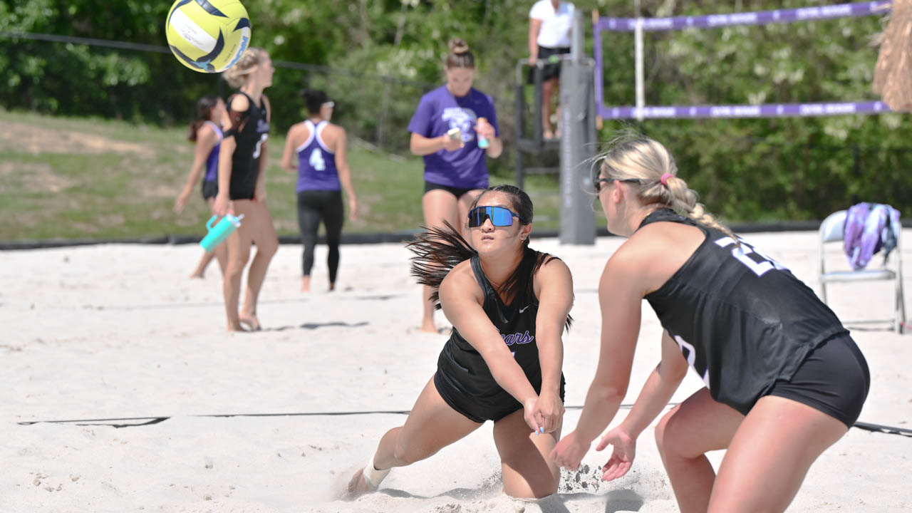 UCA's Naya Tan and Reegan Stewert returns a serve Friday at the UCA Beach Invitational