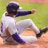 UCA Bears Tate Greene slides across home plate in a game against the Bellarmine Knights